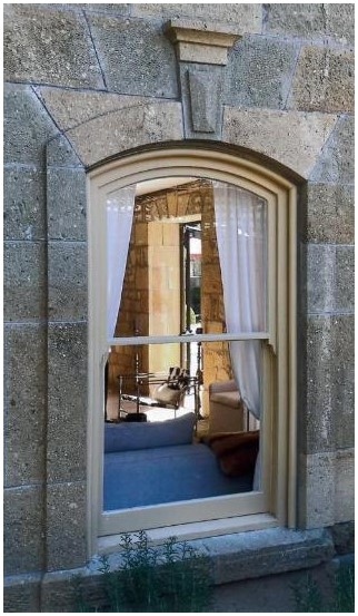 After: view of completed restored window from the exterior